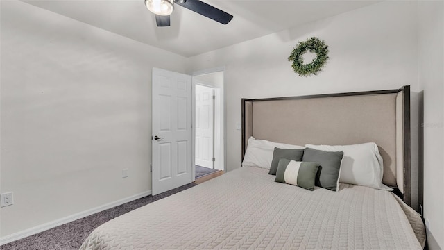 bedroom with a ceiling fan, dark colored carpet, and baseboards