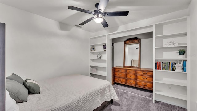 bedroom with a ceiling fan, visible vents, and light colored carpet