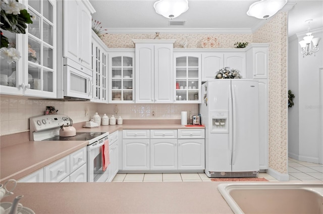 kitchen featuring visible vents, ornamental molding, white cabinetry, white appliances, and wallpapered walls