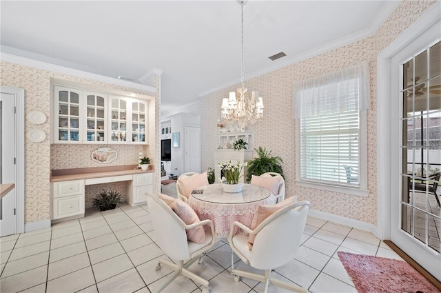 dining space featuring light tile patterned floors, built in study area, crown molding, and wallpapered walls