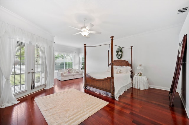 bedroom with baseboards, visible vents, wood finished floors, and ornamental molding