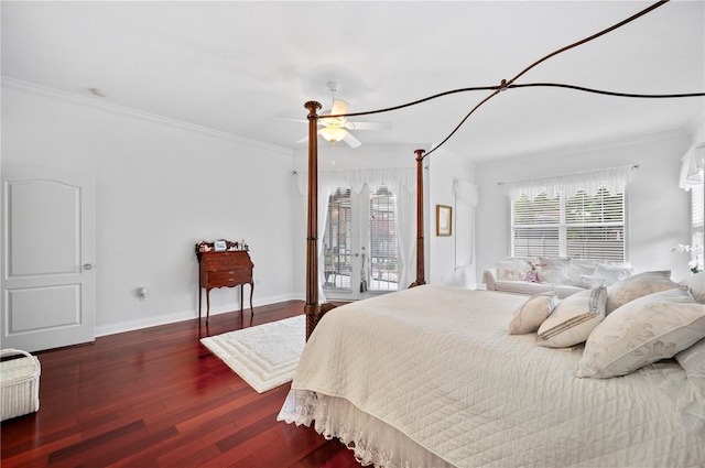 bedroom featuring multiple windows, wood finished floors, and crown molding