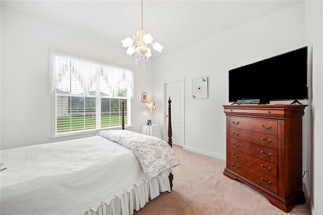 bedroom featuring a chandelier, baseboards, and light colored carpet