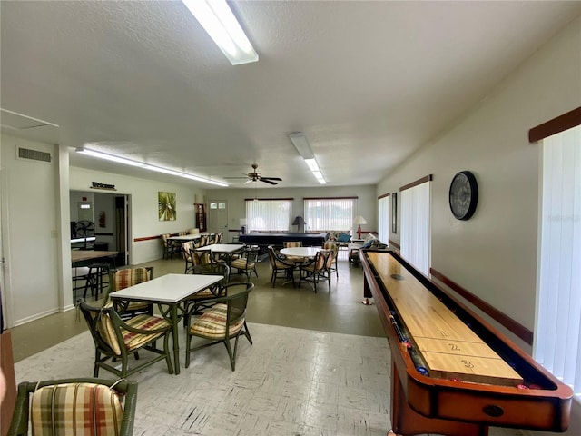 dining space featuring a ceiling fan, visible vents, and light floors