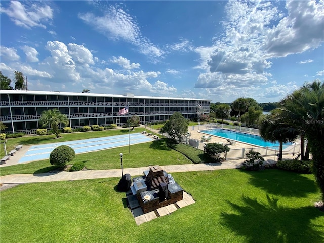 community pool with a lawn