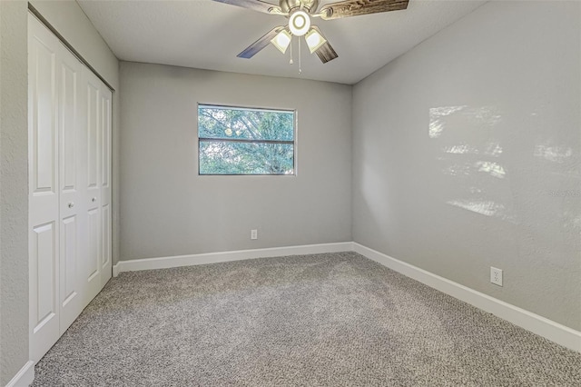 unfurnished bedroom with a closet, carpet flooring, and baseboards