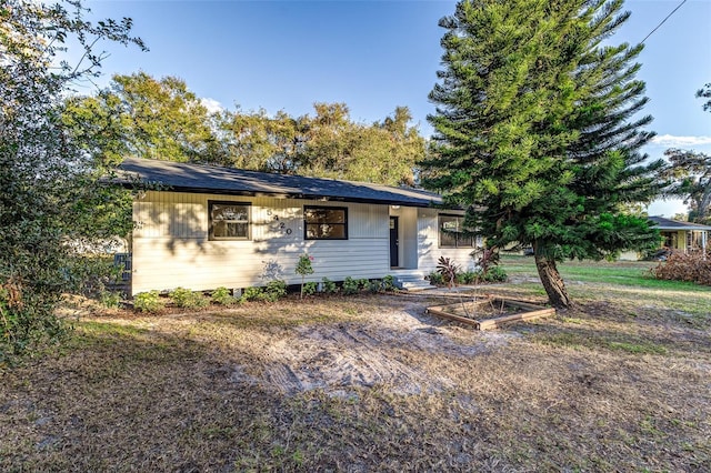 view of front of property featuring a vegetable garden