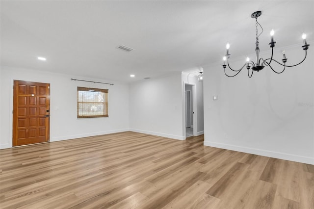 spare room with light wood-style flooring, visible vents, baseboards, and recessed lighting