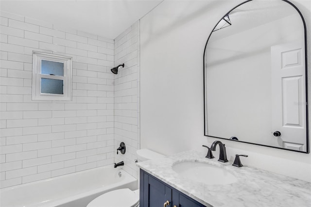 bathroom featuring toilet, shower / bath combination, and vanity