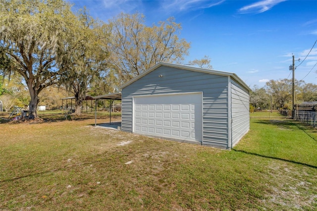 garage with a detached garage and fence