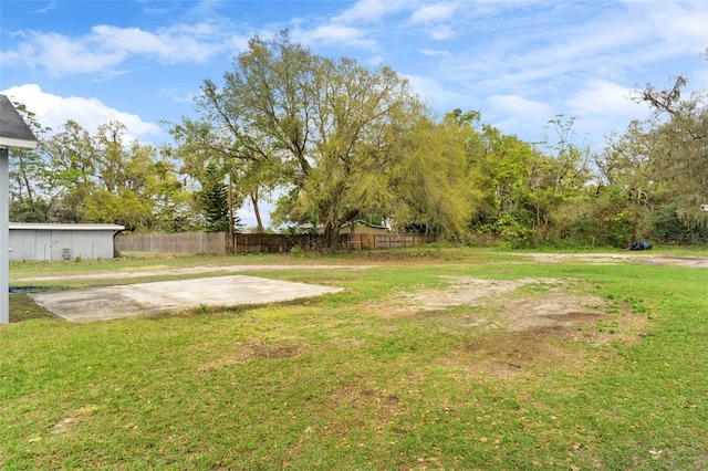 view of yard featuring a patio area and fence