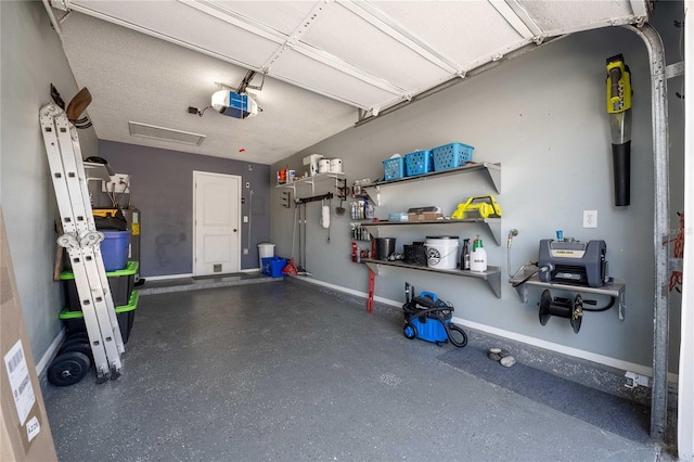 garage with baseboards and a garage door opener