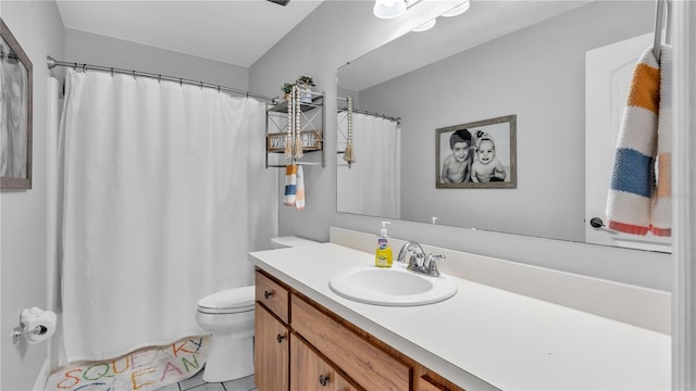 full bathroom featuring a shower with curtain, vanity, toilet, and tile patterned floors