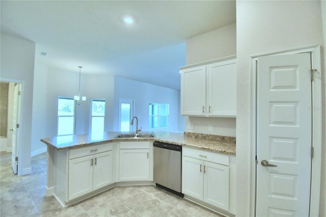 kitchen featuring dishwasher, a peninsula, a sink, and white cabinets