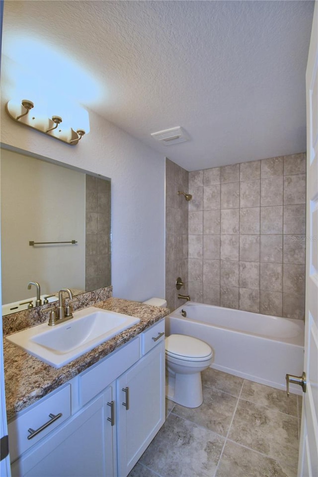 bathroom with toilet, shower / bathing tub combination, a textured ceiling, and vanity