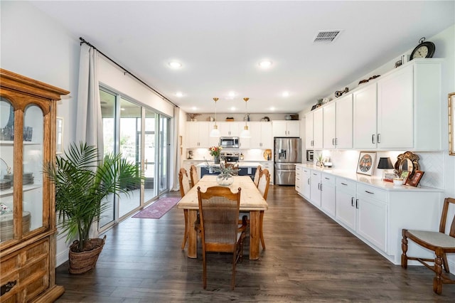 dining space with recessed lighting, dark wood-style flooring, and visible vents