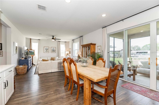 dining room with dark wood-style floors, ceiling fan, visible vents, and recessed lighting