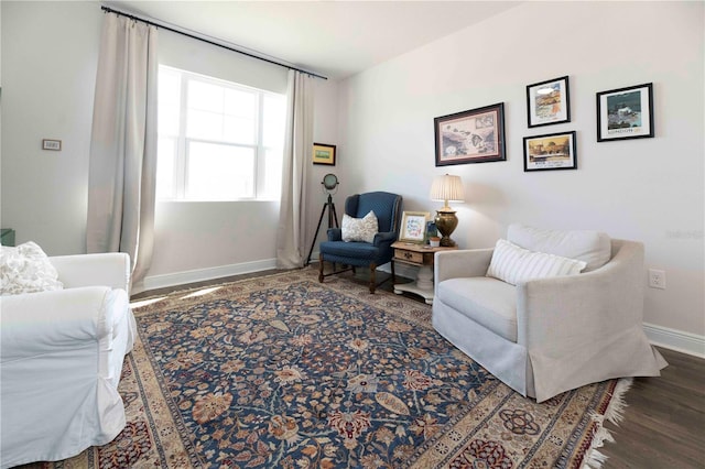 sitting room with wood finished floors and baseboards