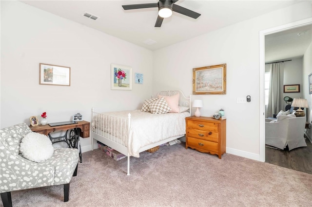 bedroom with ceiling fan, carpet flooring, visible vents, and baseboards