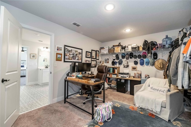 carpeted home office featuring baseboards, visible vents, and recessed lighting