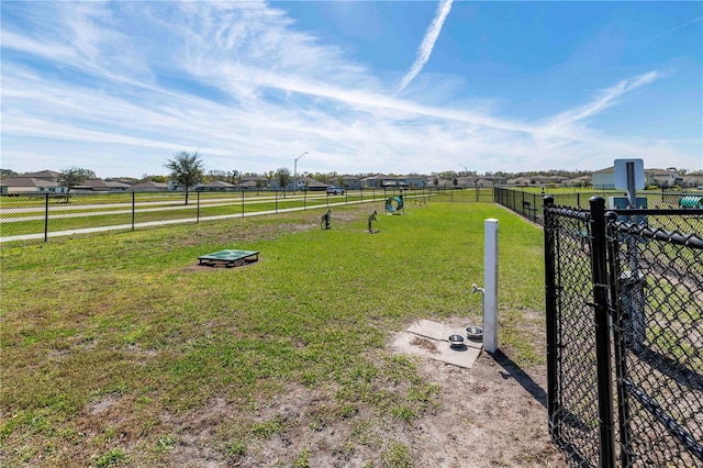 view of yard featuring a rural view and fence