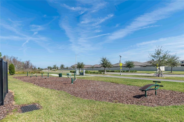 view of property's community featuring a yard