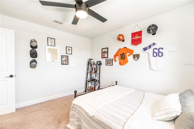 bedroom featuring visible vents, ceiling fan, light carpet, and baseboards