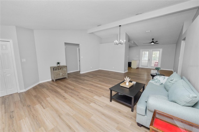 living room featuring lofted ceiling with beams, baseboards, wood finished floors, and french doors