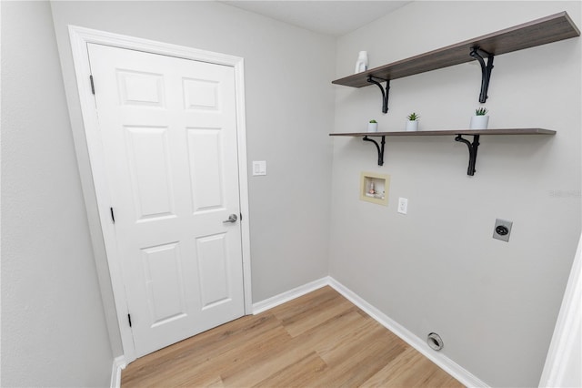 laundry area with washer hookup, light wood-style flooring, electric dryer hookup, laundry area, and baseboards