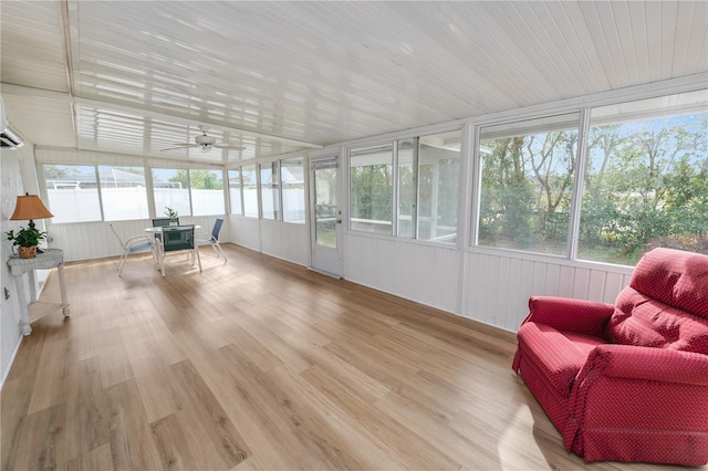 sunroom featuring ceiling fan