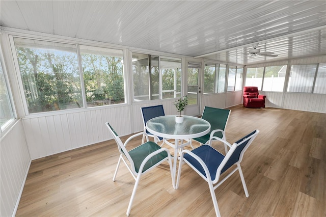 sunroom / solarium featuring ceiling fan