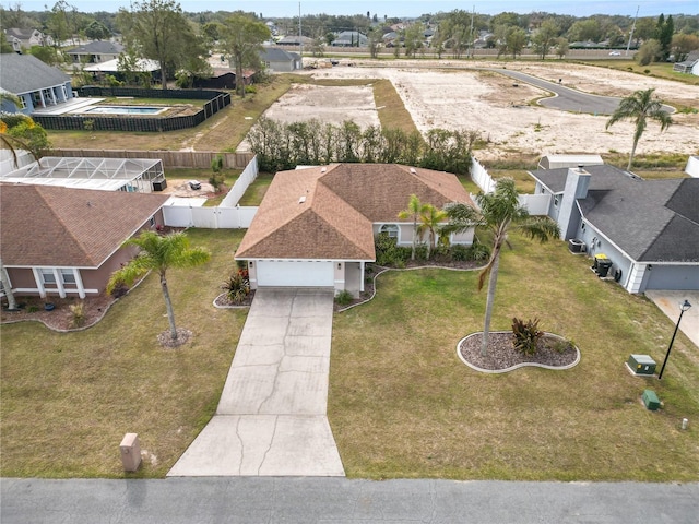 birds eye view of property with a residential view