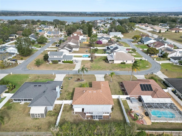 bird's eye view featuring a water view and a residential view