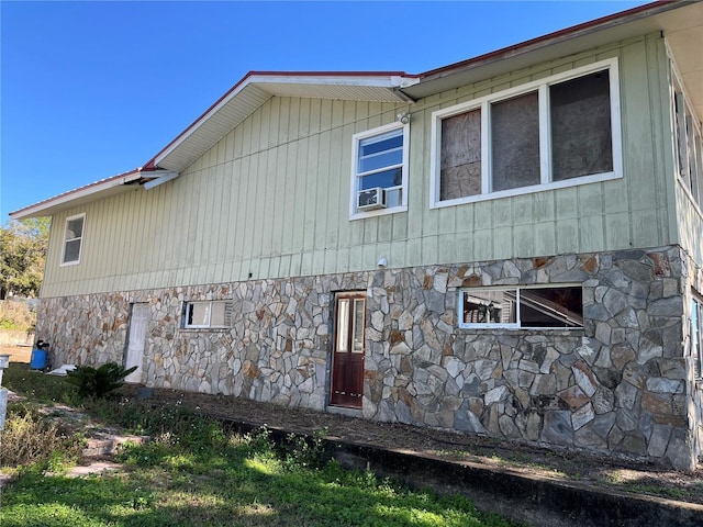 330 Callitris Ave, Polk City, FL 33868 - view of side of home featuring stone siding