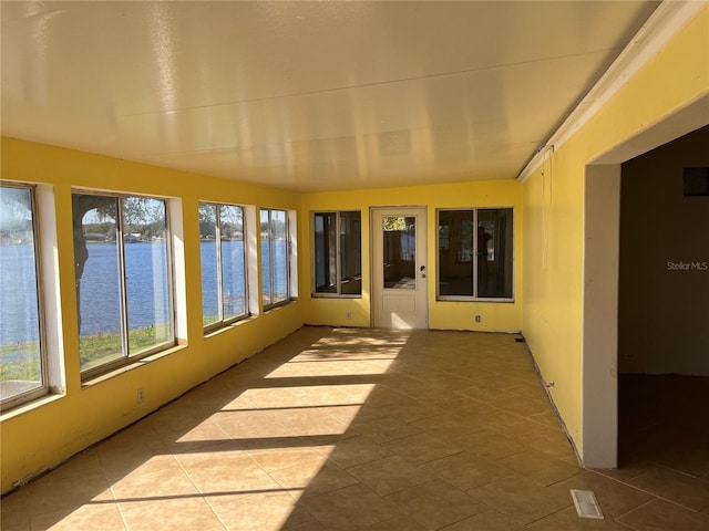 330 Callitris Ave, Polk City, FL 33868 - unfurnished sunroom with a water view