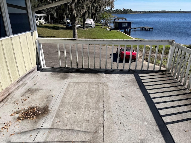 330 Callitris Ave, Polk City, FL 33868 - view of patio / terrace with a boat dock and a water view