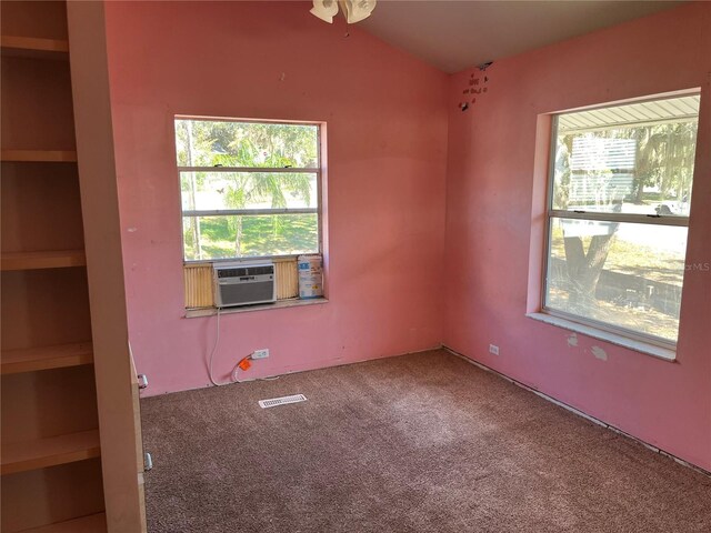 330 Callitris Ave, Polk City, FL 33868 - unfurnished room with vaulted ceiling, cooling unit, carpet flooring, and visible vents
