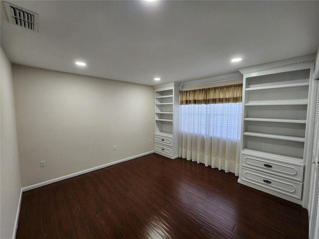 spare room featuring baseboards, visible vents, dark wood-type flooring, and recessed lighting