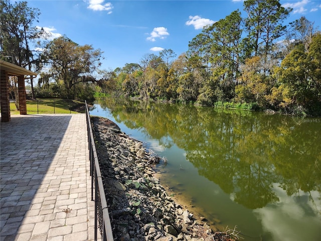 dock area featuring a water view and fence