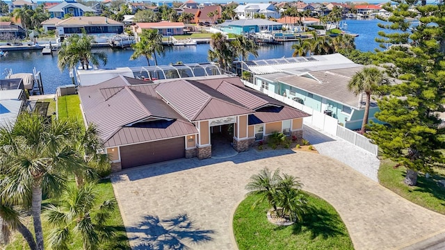 drone / aerial view featuring a residential view and a water view