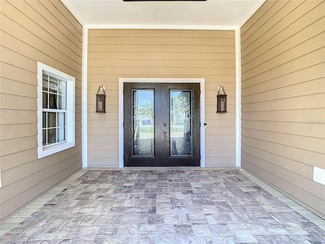 property entrance featuring french doors