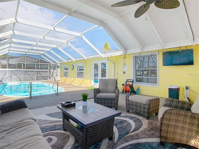 exterior space featuring glass enclosure, french doors, outdoor lounge area, and ceiling fan