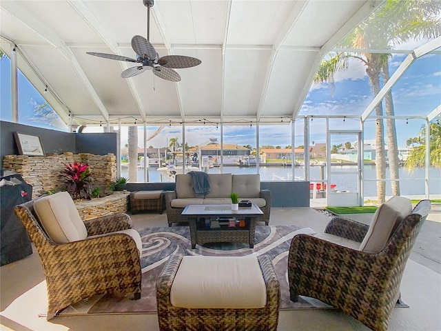 sunroom featuring ceiling fan