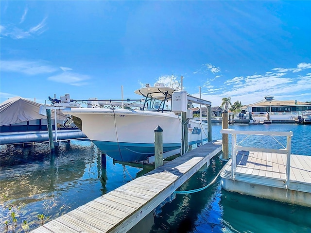 view of dock featuring a water view and boat lift