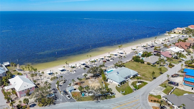 aerial view with a beach view, a water view, and a residential view