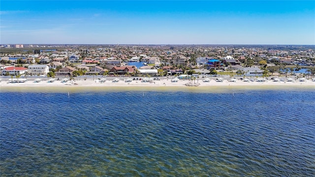 bird's eye view featuring a residential view, a water view, and a beach view