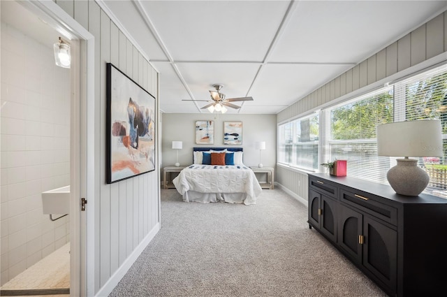 bedroom featuring light carpet and ceiling fan