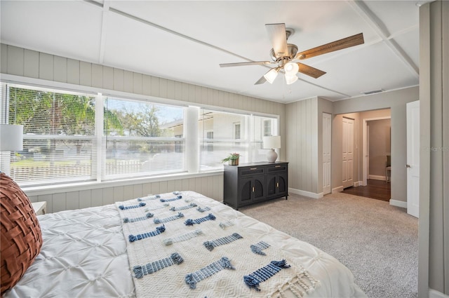 bedroom with baseboards, multiple windows, visible vents, and light colored carpet