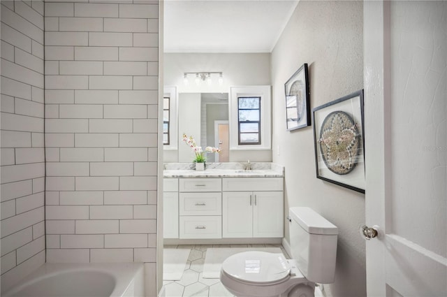 bathroom featuring tub / shower combination, vanity, toilet, and crown molding