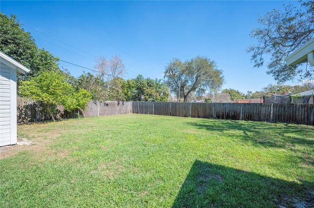 view of yard with a fenced backyard